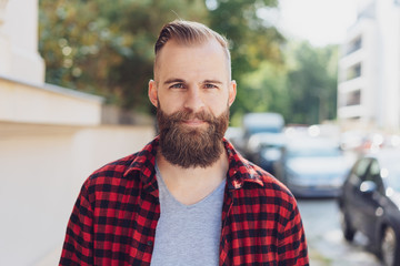 Man approaching the camera down an urban street