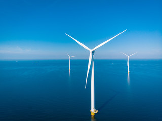 Wall Mural - windmill park offshore and onshore windmill farm in the netherlands