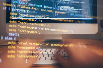 Wall Mural - programmer hands working at home with computer. man writing a code. men programmer hands on the keyb