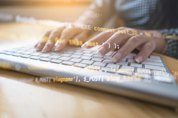 Wall Mural - programmer hands working at home with computer. woman writing a code. female programmer hands on the