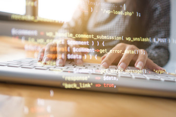 Wall Mural - programmer hands working at home with computer. woman writing a code. female programmer hands on the
