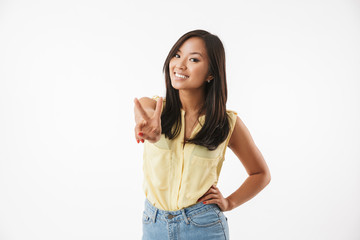 Poster - Happy young asian woman showing peace gesture.