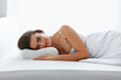 © puhhha - Orthopedic Pillow. Woman Lying In Bed