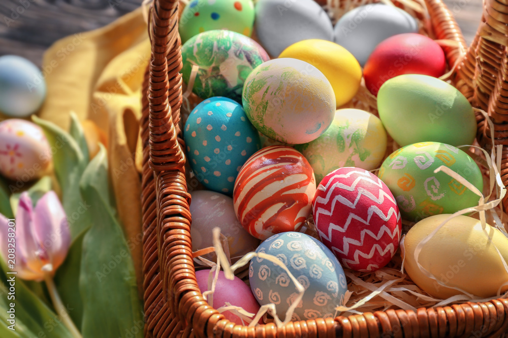 Easter basket with colorful eggs, closeup