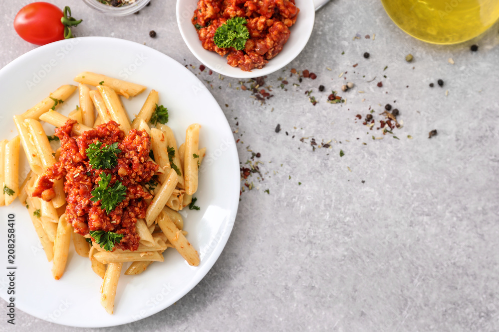 Composition with tasty penne pasta on table