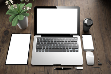 Wall Mural - top view of white screen devices on wooden table