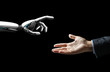 artificial intelligence, future technology and communication concept - robot and human hand over black background