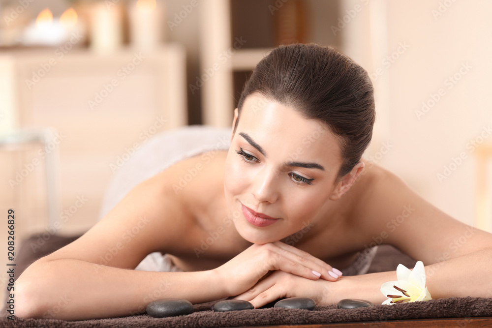 Young woman relaxing in spa salon