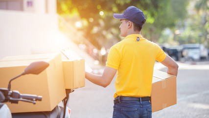 delivery man with cardboard boxes. delivery, mail, people and shipment concept