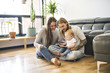 © Louis-Paul Photo - family with her baby and a book in the living room