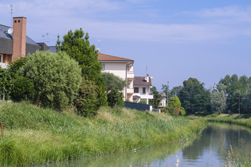 Poster - Rovigo, Italy - June, 5, 2018: house on the bank of a river in the vicinity of Rovigo, Italy