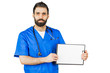 © fusssergei - Doctor in blue robe with stethoscope pointing to clipboard isolated on white background