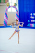 © travnikovstudio - Beautiful little active gymnast girl with her performance on the carpet