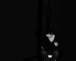 © elenaara - Woman dressed in black on a black background