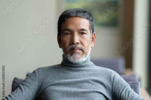Portrait Of Attractive Mature Asian Man Retired With White Stylish