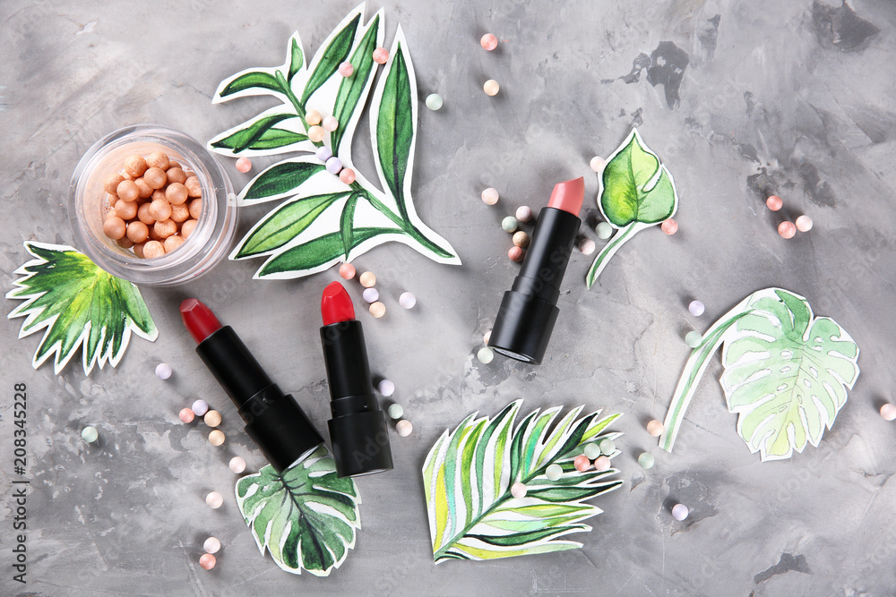 Flat lay composition with professional cosmetics on grey background