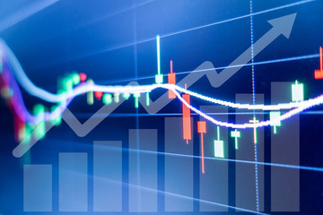 Stock market graph and candlestick chart for financial investment concept.