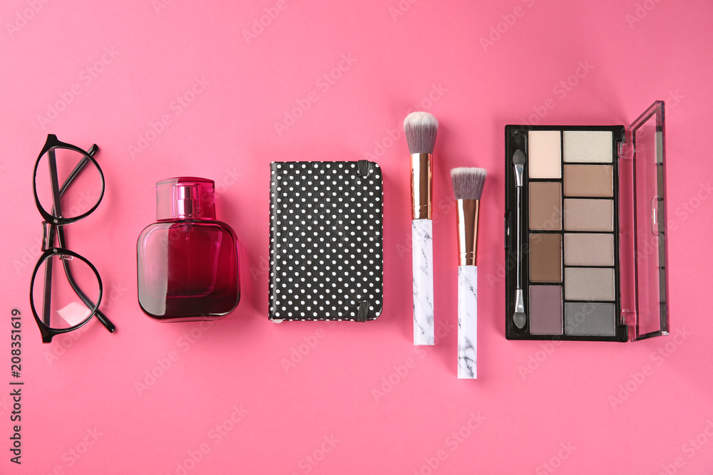 Flat lay composition with professional cosmetics on color background