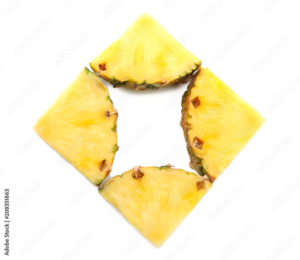 Composition with slices of juicy pineapple on white background