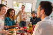 © jackfrog - Multi-ethnic group of friends cooking lunch in the kitchen.