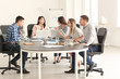 © Pixel-Shot - Young people having business meeting in office