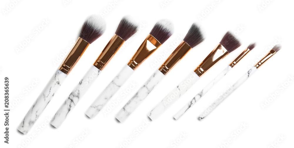 Set of cosmetic brushes on white background, top view