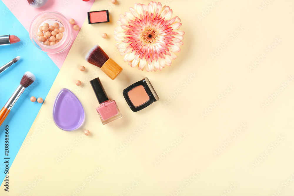 Flat lay composition with decorative cosmetics on color background