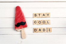 Father's Day Greeting Card With Funny Ice Cream And Wooden Tiles Comic Text On White Wooden Background.