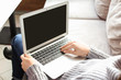 © Pixel-Shot - Woman using laptop indoors, closeup
