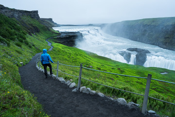 Wall Mural - Tourist on a trip near the Gullfoss waterfall in Iceland