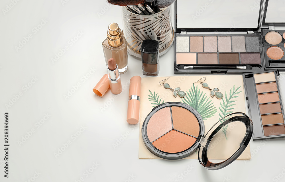 Composition with decorative cosmetics on white background