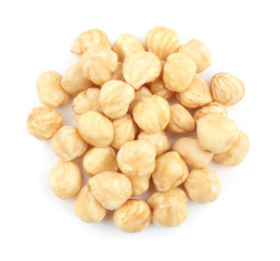 Peeled hazelnuts on white background