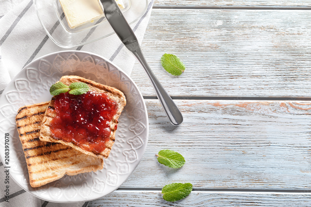 Delicious toasts with sweet jam on plate