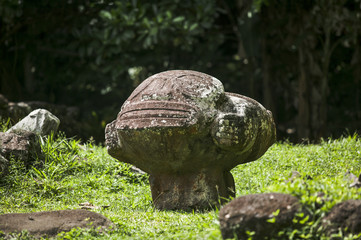 historic stone statues, so called Tikis, created by native inhabitants of Hiva Oa,  Marquesas Islands, French Polynesia