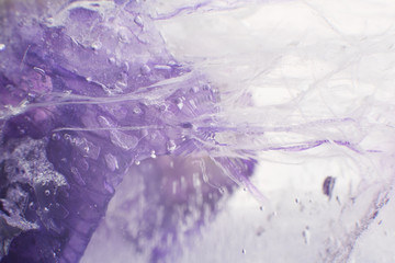 Wall Mural - Airy delicate bubbles flowing through ice with purple colors underneath 2