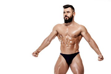 Handsome strong bodybuilder posing