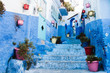 Blue Alley with Flower Pots in Medina, Chefchaouen, Moroco