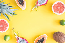 Summer Fruits. Pineapple, Coconut, Papaya, Dragon Fruit, Orange On Yellow Background. Summer Concept. Flat Lay, Top View, Copy Space