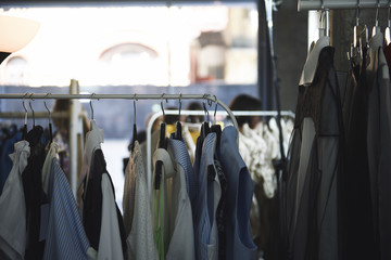 Women clothing on hangers in a boutique store