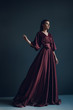 © Mirrorstudio - Young elegant girl in burgundy dress