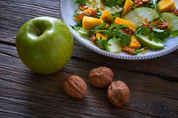 Wall Mural - Arugula mango and apple salad healthy