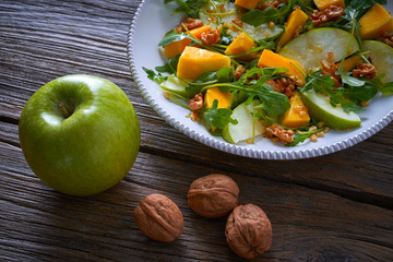 Wall Mural - Arugula mango and apple salad healthy