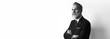 © SFIO CRACHO - Portrait of bearded confident businessman wearing trendy suit over empty white background. Copy Paste text space. Wide. Black and White