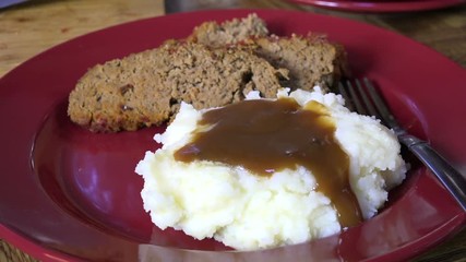 Poster - Spooning gravy onto hot mashed potatoes