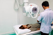 © Nawarit - Asian male radiologist preparing and setting up X-rays.