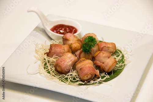 Fotografía Deep Fried Bacon Wrapped Sausage with sauce