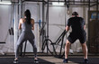 © .shock - sports couple doing battle ropes cross fitness exercise