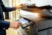Bussiness Man Hand Press Button On Panel Of Printer, Printer Scanner Laser Office Copy Machine Supplies Start Concept.