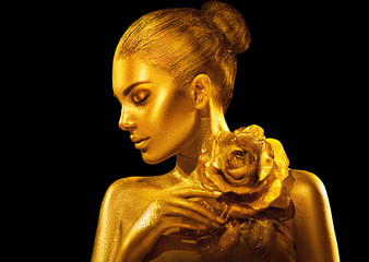 Wall Mural - Golden skin woman with rose. Fashion art portrait. Model girl with holiday golden glamour shiny professional makeup. Gold jewellery, accessories