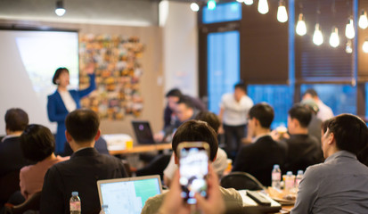 Fototapete - Blurred De-focused Unidentifiable Presenter and Audience in Meeting Room. Speaker During Conference Lecture.